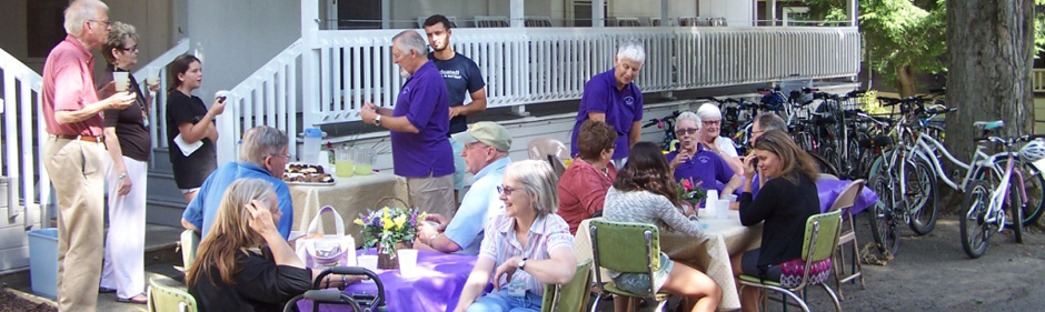 Ecumenical community social in front of shaw and bir-werner houses