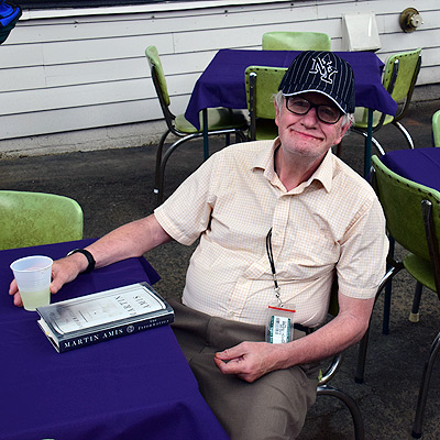 Gentleman stting at table with lemonade during porch blessing
