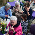 Ladies enjoying conversation and refreshments during porch blessing