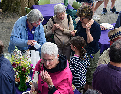Ladies enjoying conversation and refreshments during porch blessing