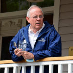 David Matthews on Bird-Werner porch during porch blessing dedication