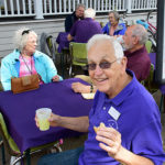 Tom Kerns and Matilda enjoying refreshments and conversation during porch blessing dedication