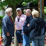 Jim Vreeland conversing with Boehm's and gentleman during porch blessing dedication