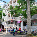 Front view of new Bird-Werner and Shaw porches during porch blessing dedication