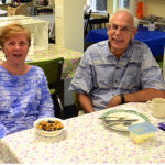 Couple seated at table in Shaw House kitchen