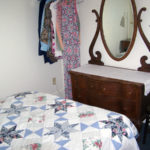 Bird-Werner room showing full sized bed and dresser