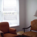 Shaw house room showing two chairs near window