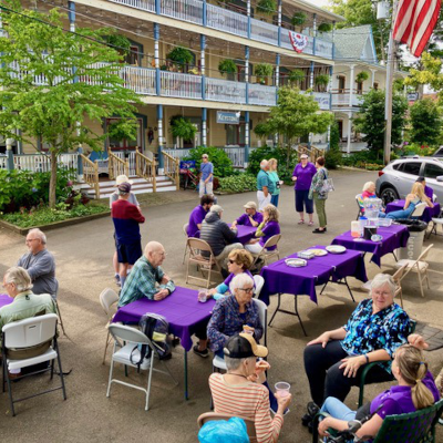 ecoc social hour in front of shaw and bird werner houses