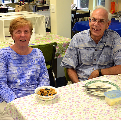 couple enjoying breakfast in the shaw house kitchen
