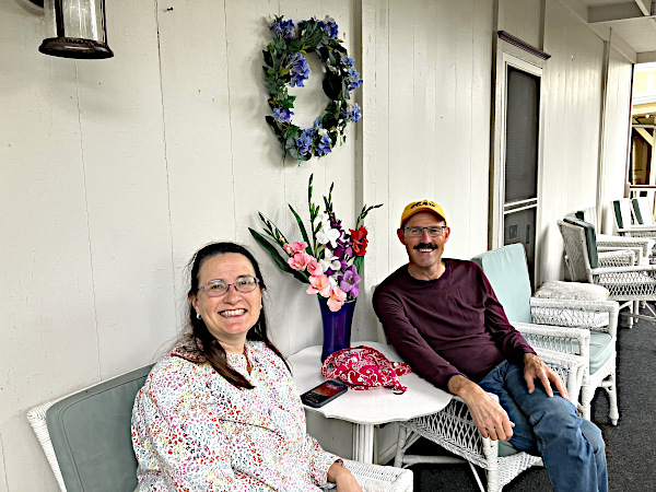 Female and male ECOC members enjoying time on the Shaw porch
