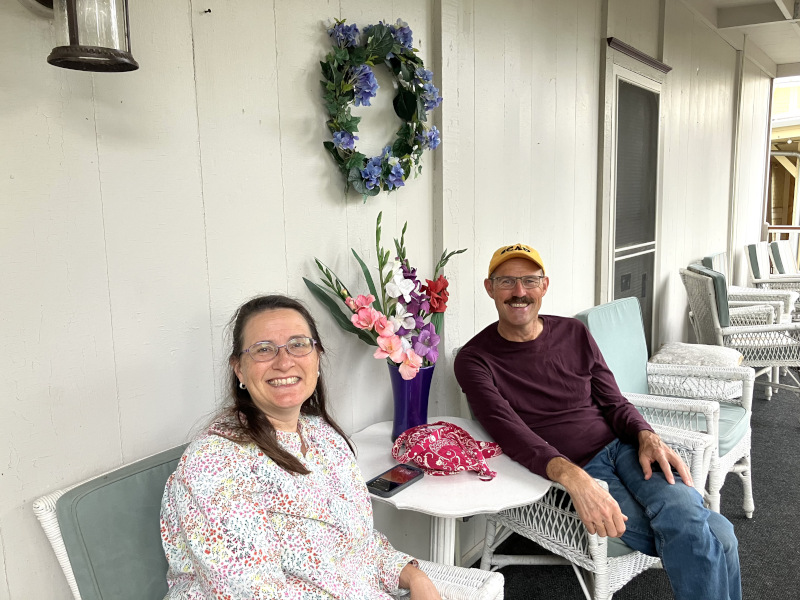 Female and male ECOC members enjoying time on the Shaw porch